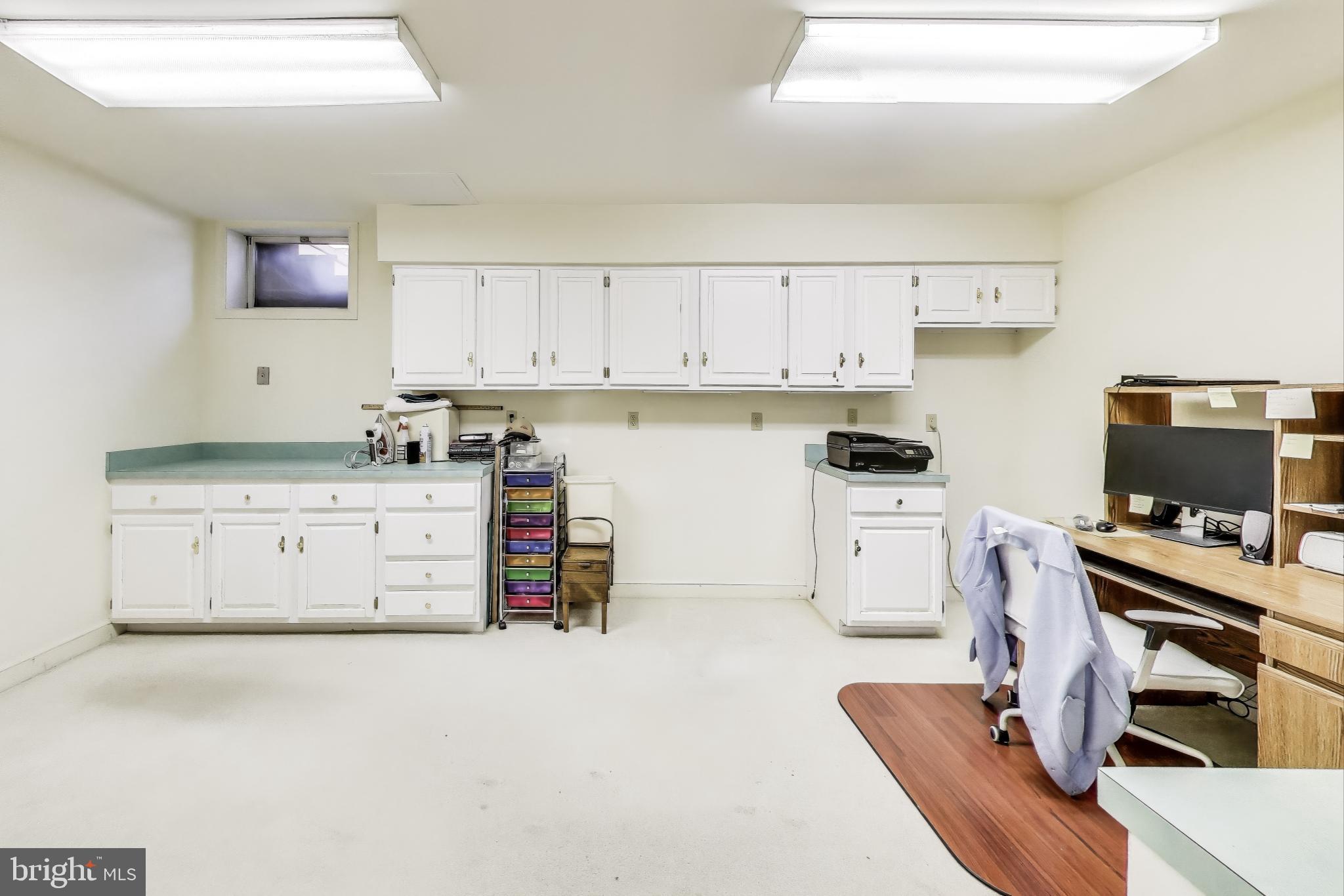 9201 Centerway Road Gaithersburg, MD 20879 - Photo 32 of 53 a kitchen with stainless steel appliances a stove and white cabinets