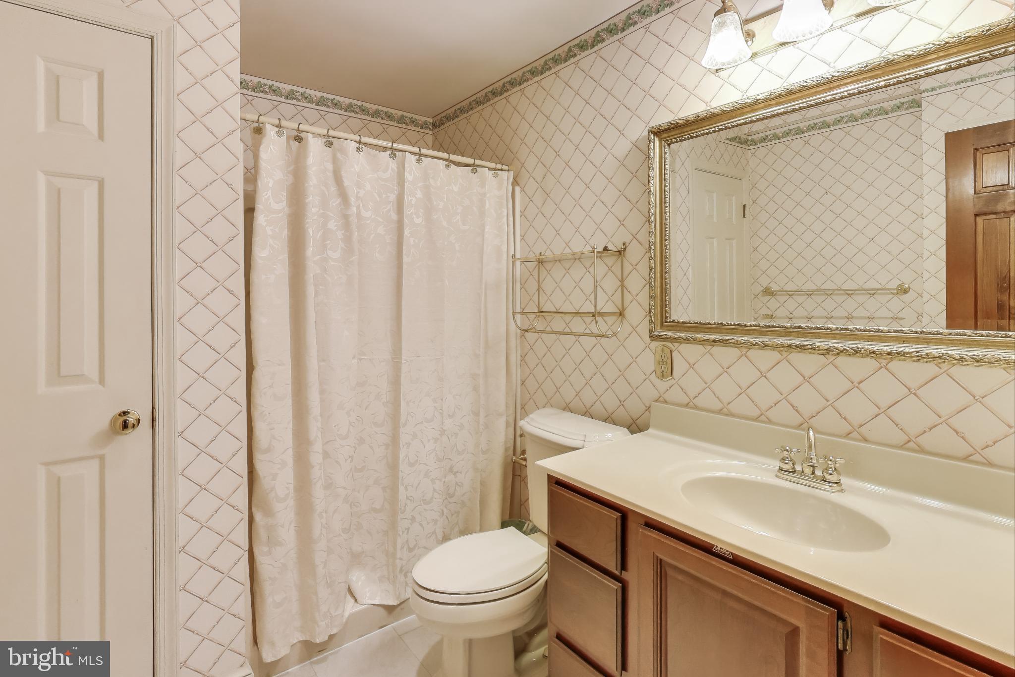 9201 Centerway Road Gaithersburg, MD 20879 - Photo 34 of 53 a bathroom with a sink toilet and shower