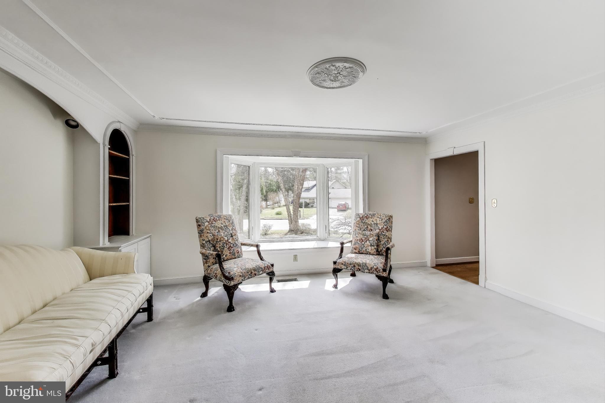 9201 Centerway Road Gaithersburg, MD 20879 - Photo 4 of 53 a living room with furniture and a large window