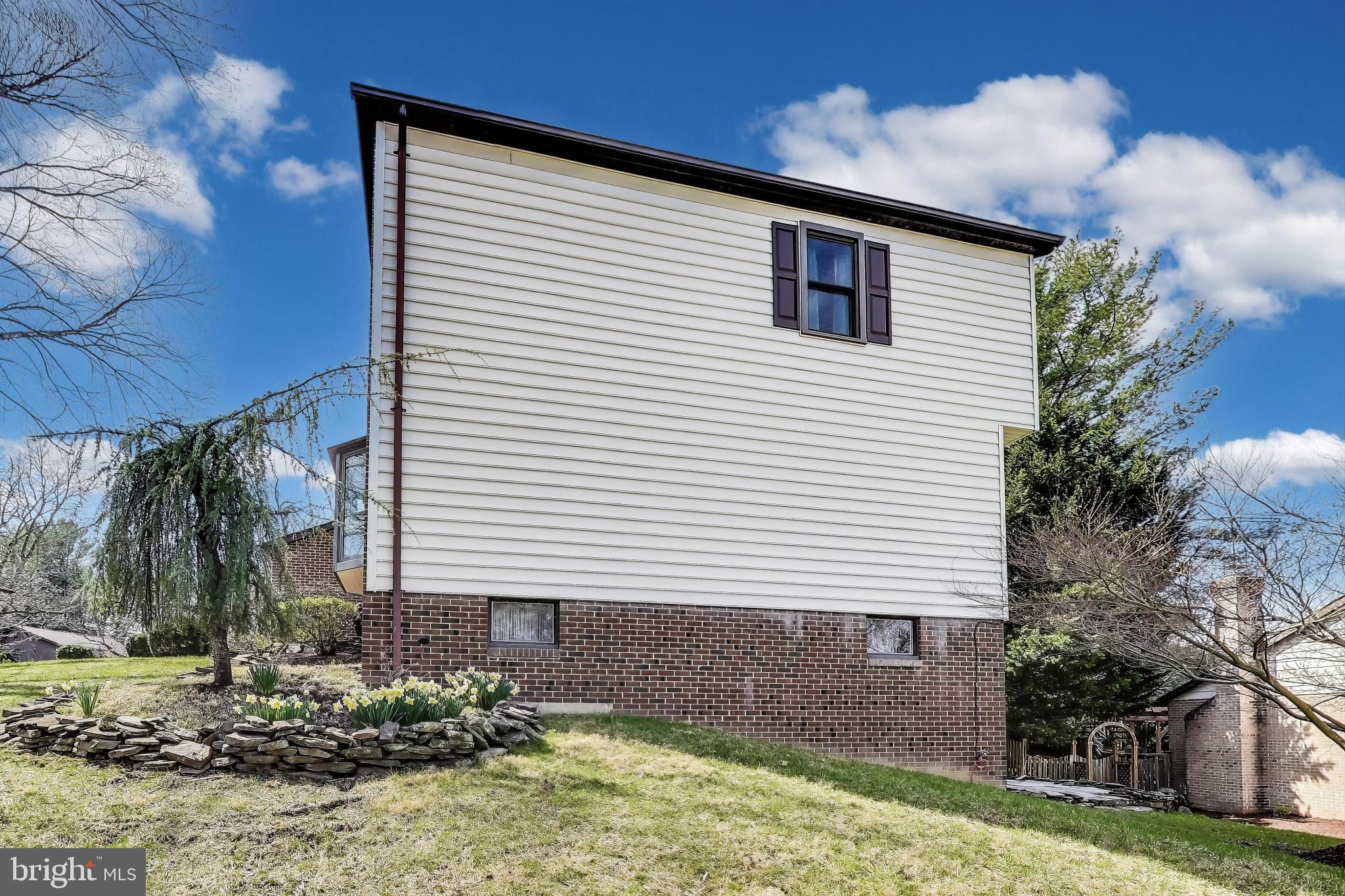 9201 Centerway Road Gaithersburg, MD 20879 - Photo 41 of 53 a front view of a house with garden