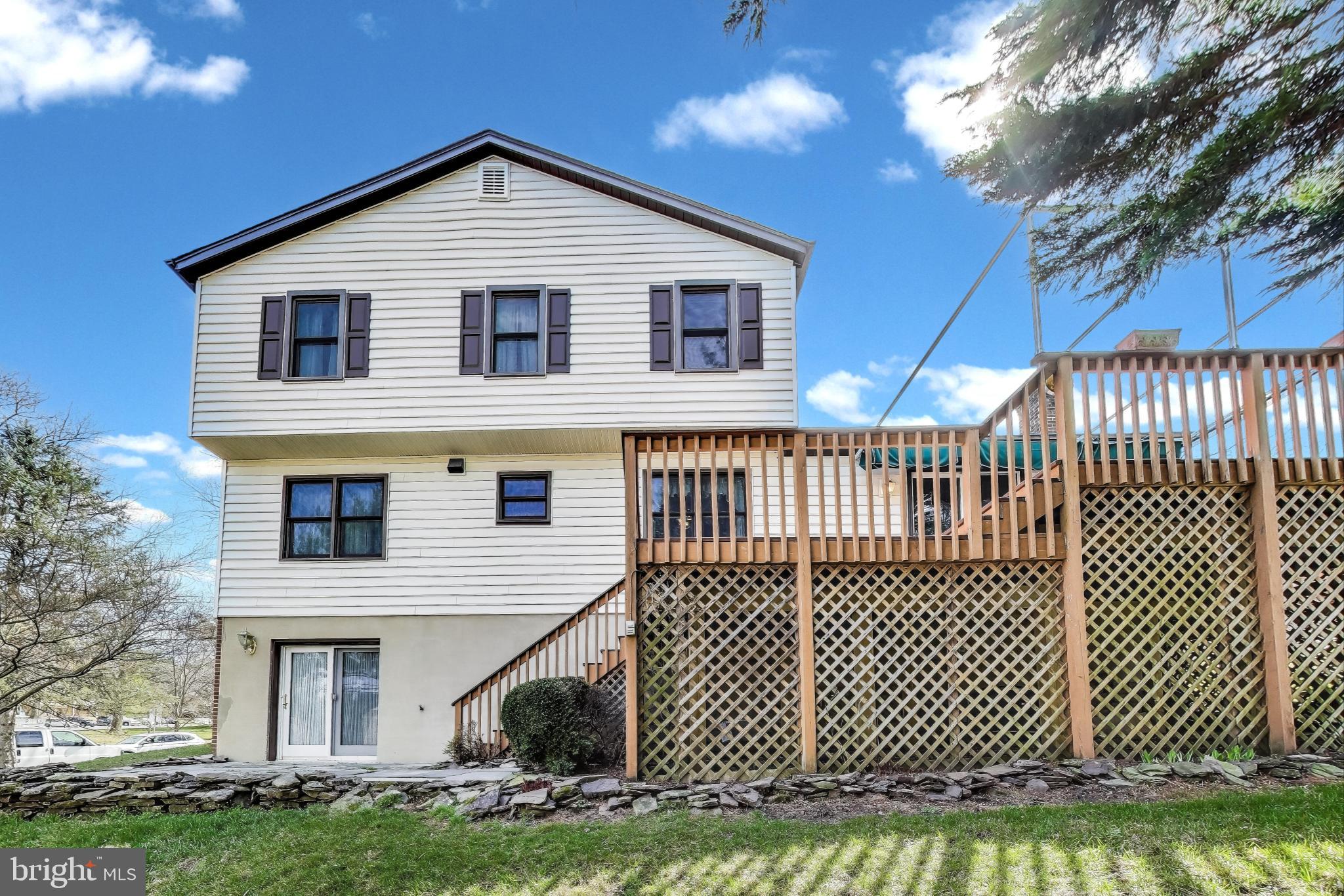 9201 Centerway Road Gaithersburg, MD 20879 - Photo 42 of 53 a front view of a house with a yard