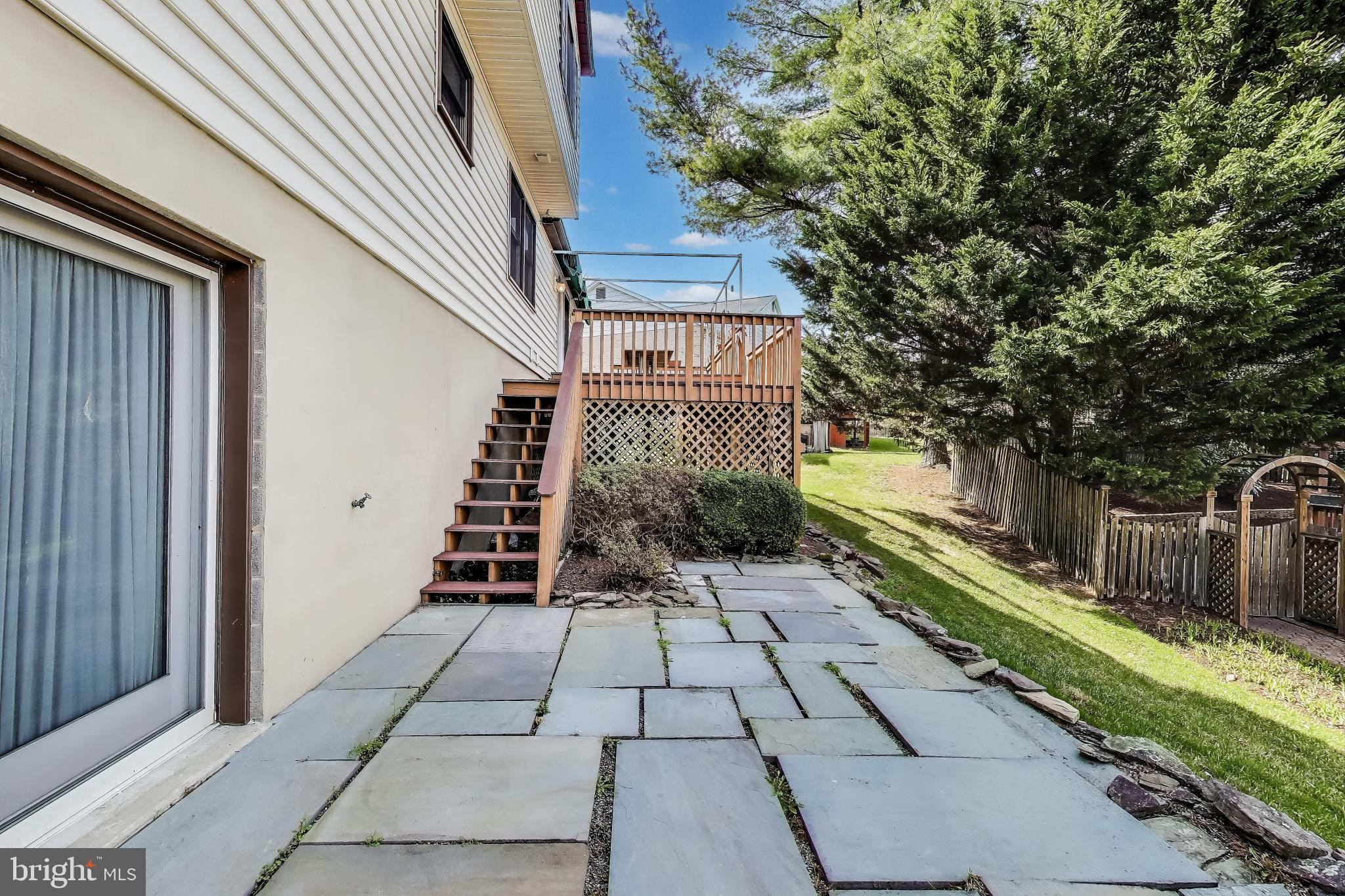 9201 Centerway Road Gaithersburg, MD 20879 - Photo 45 of 53 a view of a pathway of a house with a yard