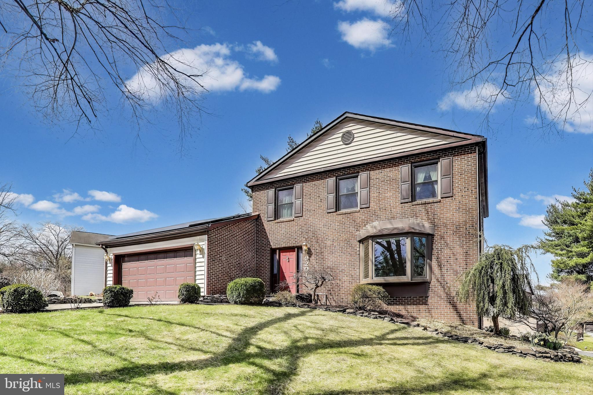 9201 Centerway Road Gaithersburg, MD 20879 - Photo 50 of 53 a front view of a house with a yard