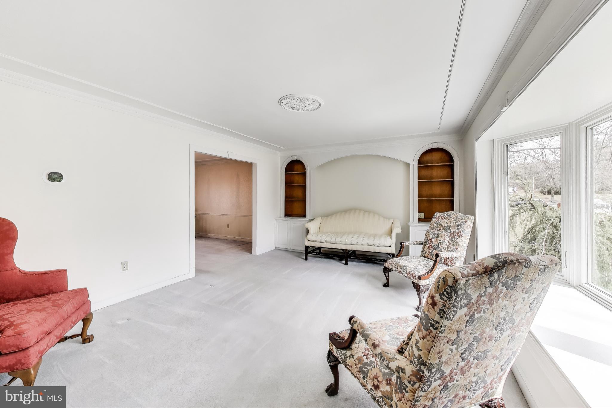9201 Centerway Road Gaithersburg, MD 20879 - Photo 5 of 53 a living room with furniture and a large window