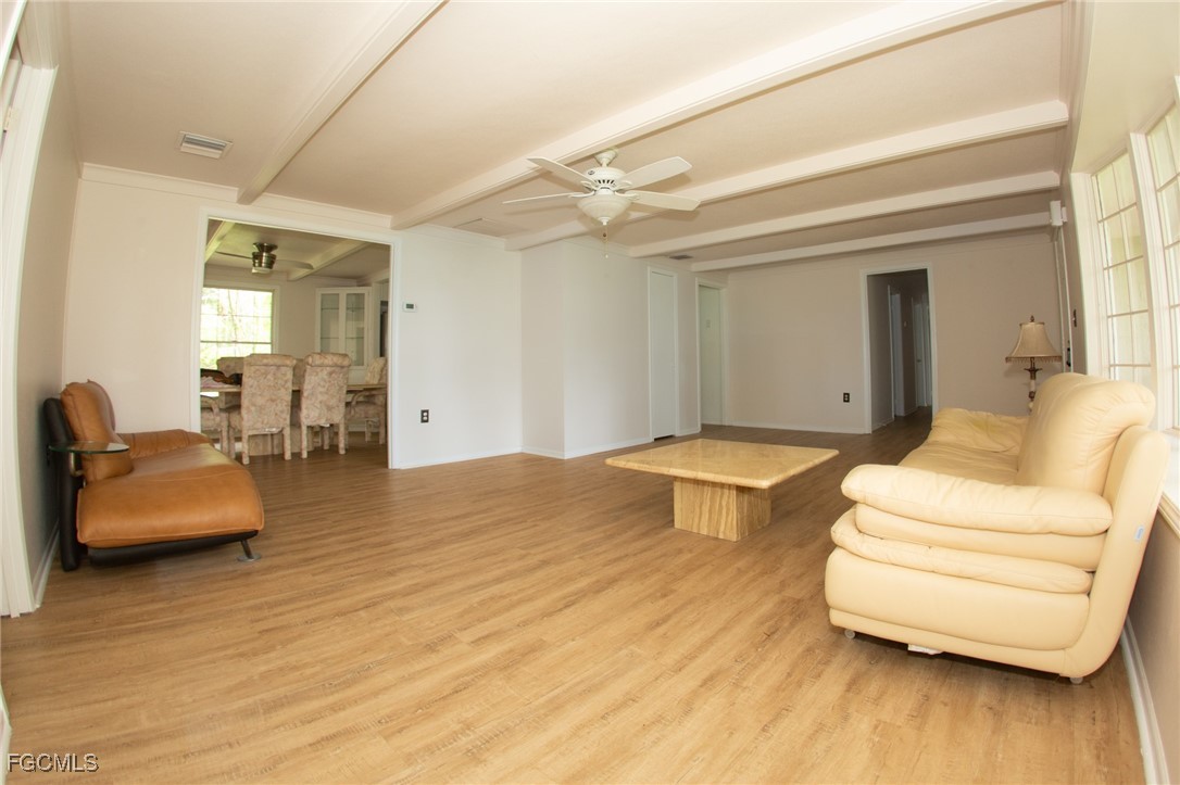 4055 County Road 78 Fort Denaud, FL 33935 - Photo 15 of 28 a spacious bedroom with a bed and a couch