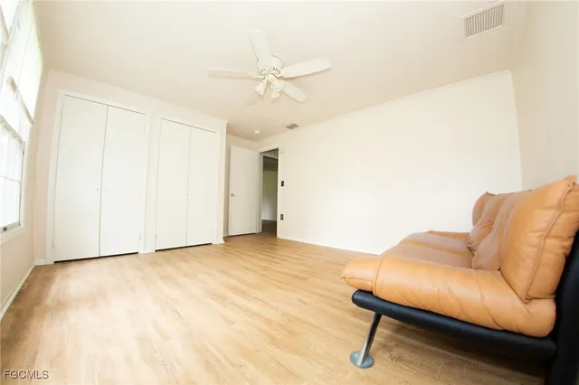 a view of livingroom with furniture and ceiling fan