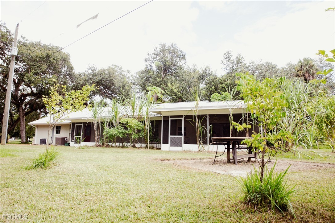 4055 County Road 78 Fort Denaud, FL 33935 - Photo 27 of 28 a view of a house with sitting area and garden