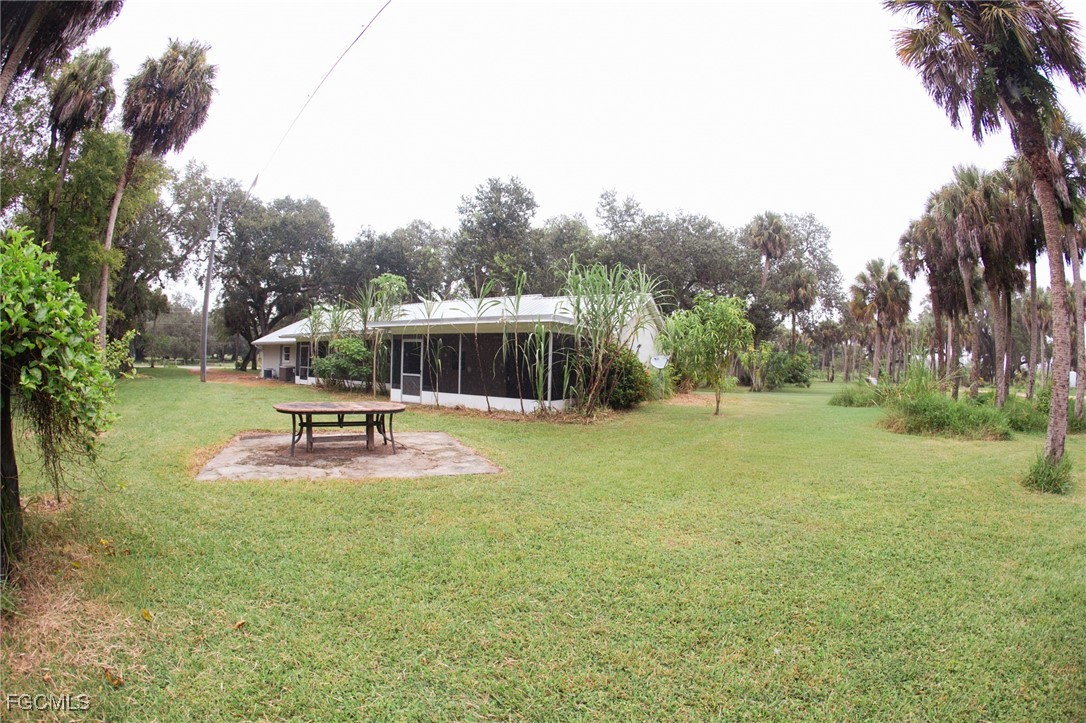4055 County Road 78 Fort Denaud, FL 33935 - Photo 28 of 28 a swimming pool with wooden fence