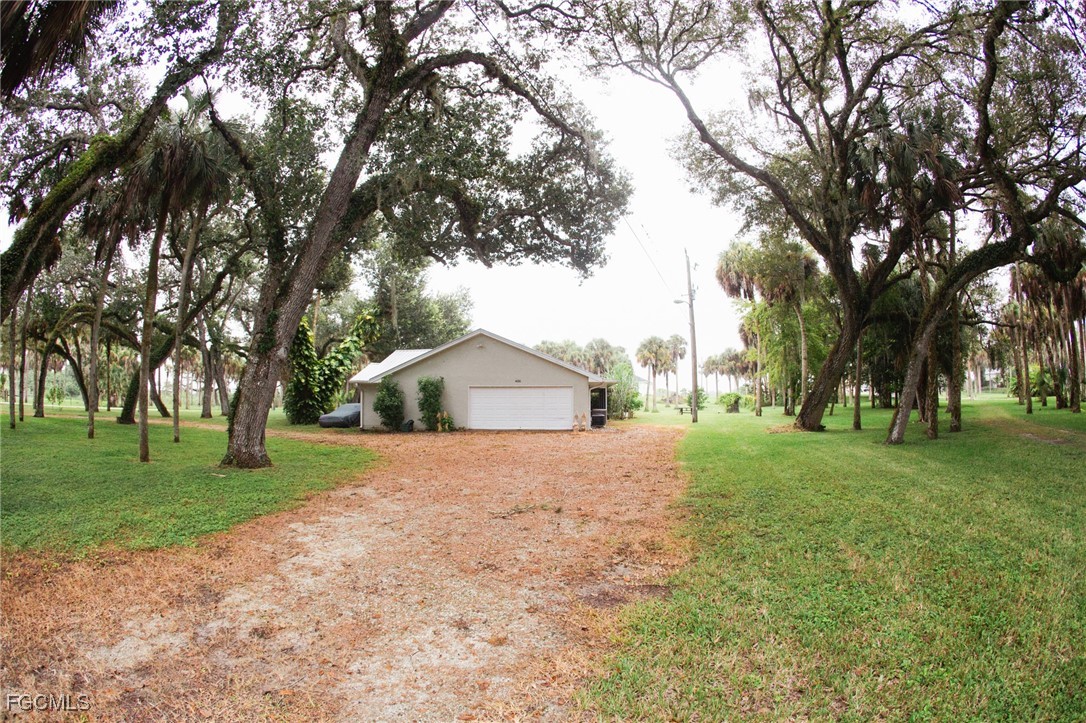 4055 County Road 78 Fort Denaud, FL 33935 - Photo 5 of 28 a view of a house with a yard