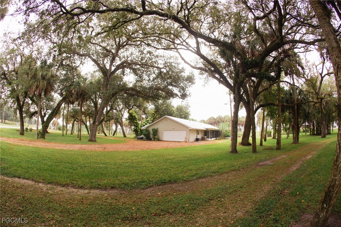 4055 County Road 78 Fort Denaud, FL 33935 - Photo 6 of 28 a view of grassy field with trees