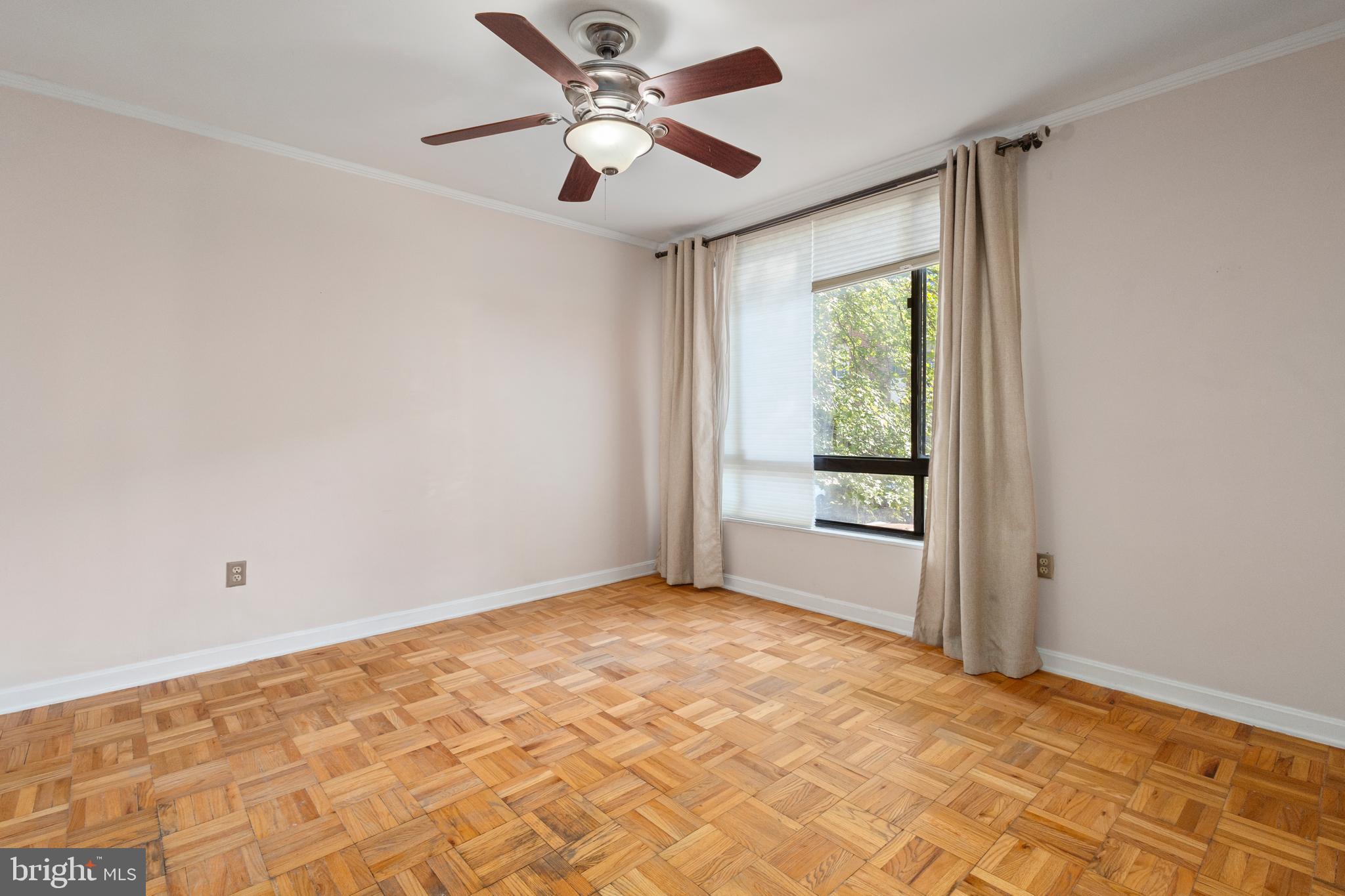 3825 Davis Place Northwest, Unit 103 Washington, DC 20007 - Photo 11 of 26 a view of an empty room with a window