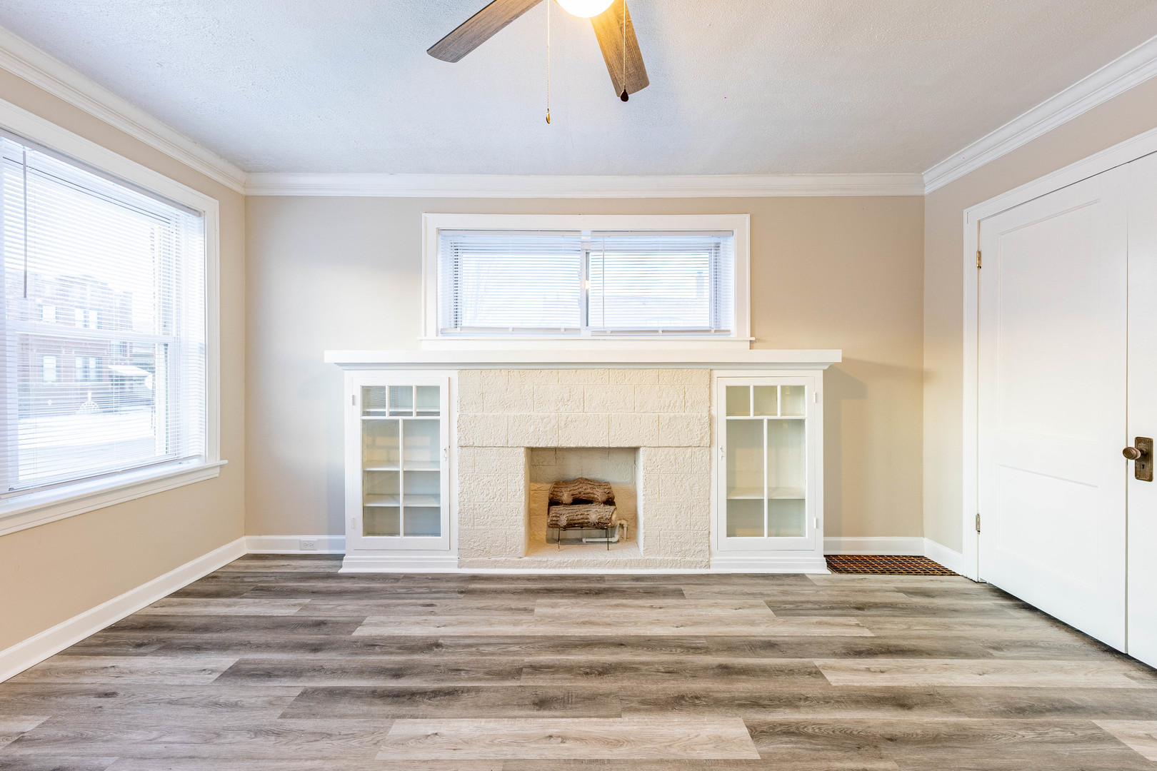 8401 South Paulina Street, Unit 1 Chicago, IL 60620 - Photo 2 of 17 a living room with a fireplace and a window