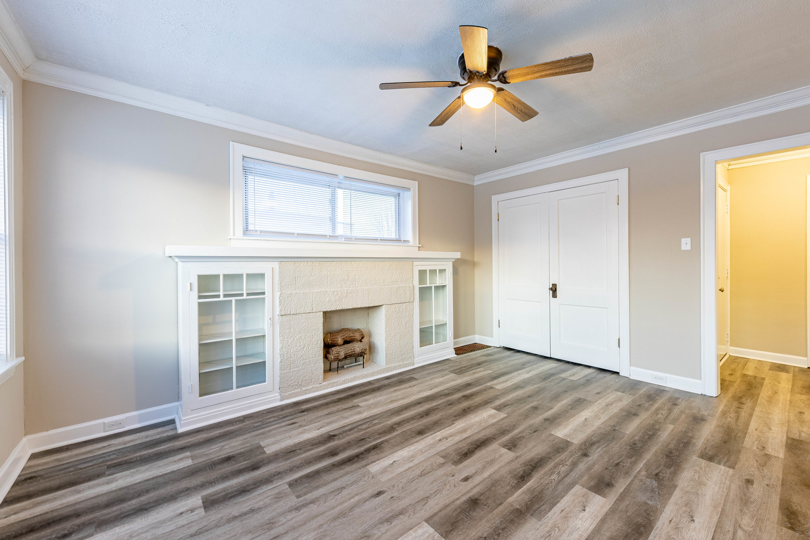 8401 South Paulina Street, Unit 1 Chicago, IL 60620 - Photo 6 of 17 wooden floor in an empty room with a fireplace