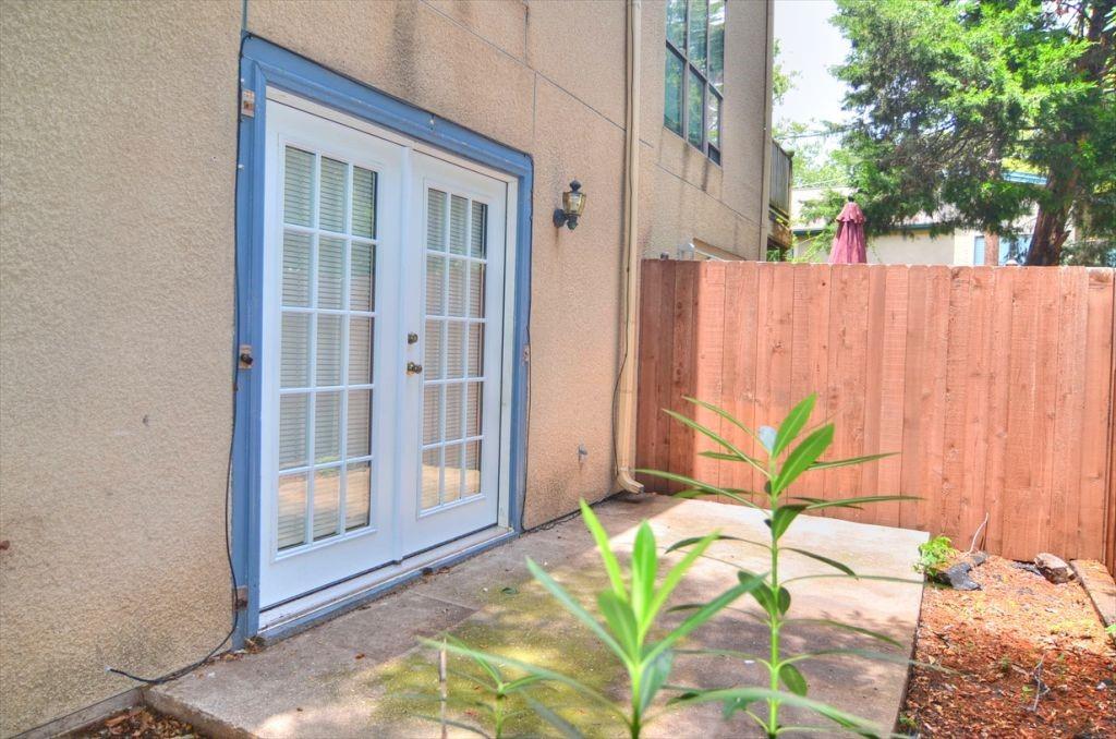 6503 Ridgecrest Road, Unit 110/J Dallas, TX 75231 - Photo 9 of 10 a potted plant in front of a door