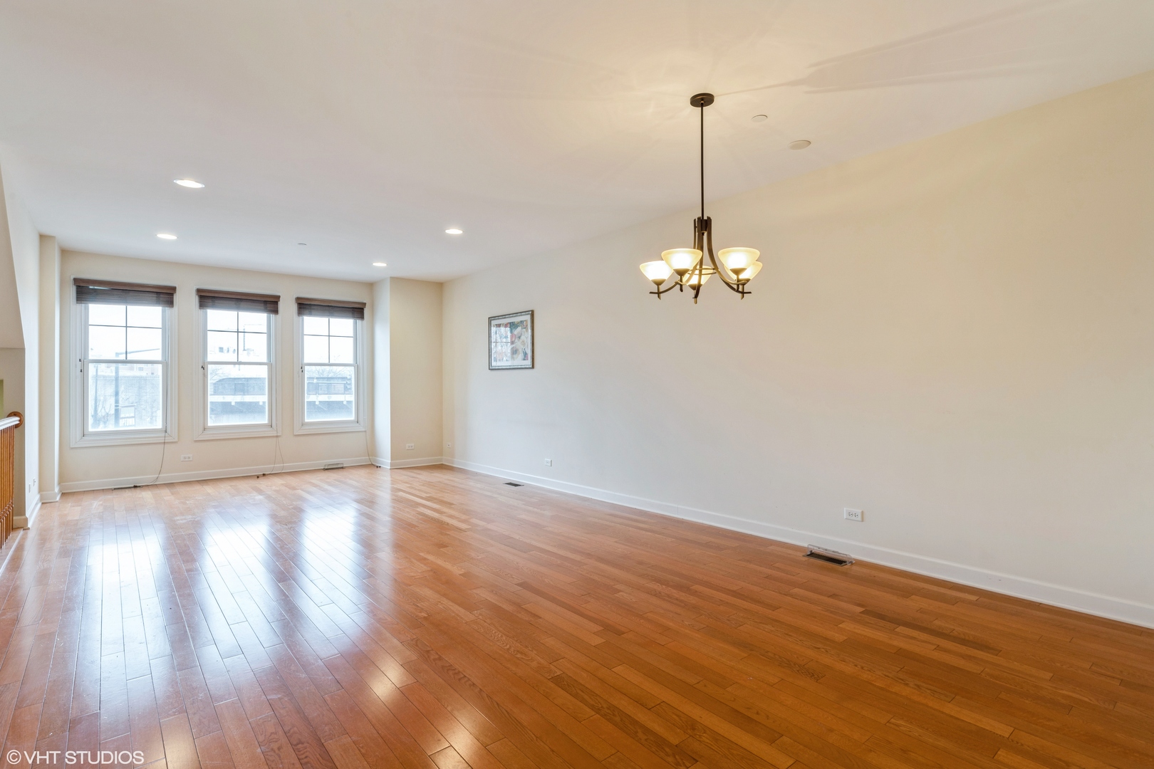 13 Busse Highway Park Ridge, IL 60068 - Photo 4 of 28 a view of empty room with wooden floor and fan