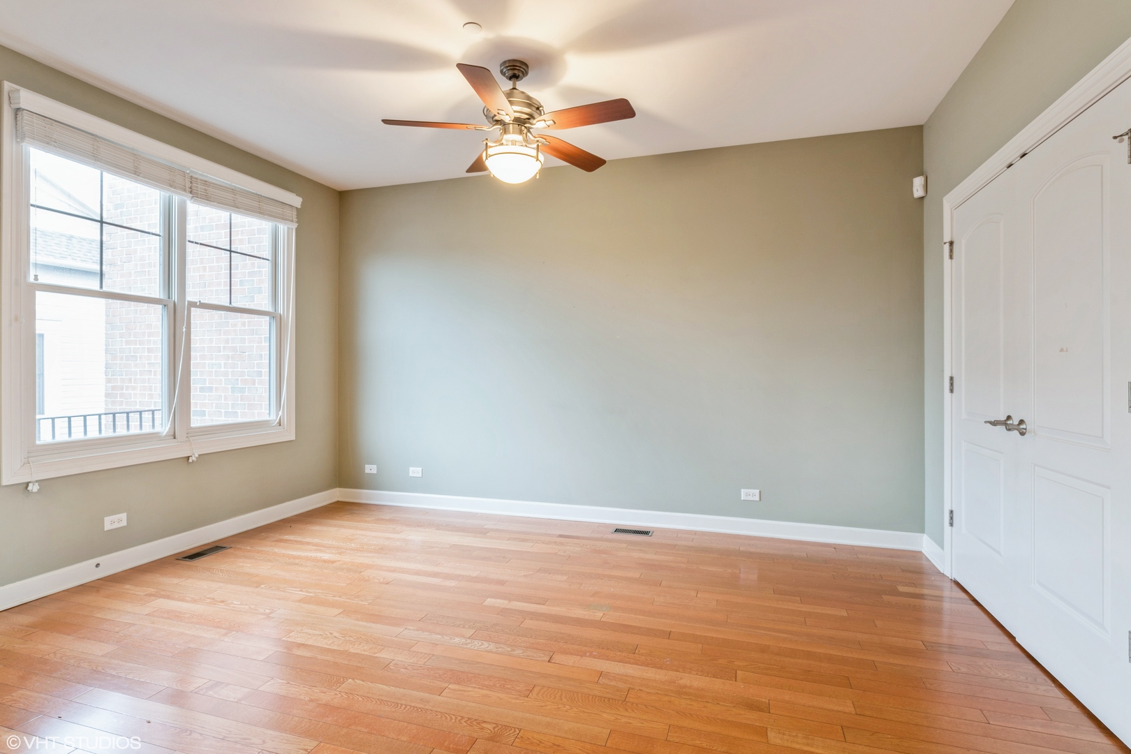 13 Busse Highway Park Ridge, IL 60068 - Photo 5 of 28 wooden floor in an empty room with a window