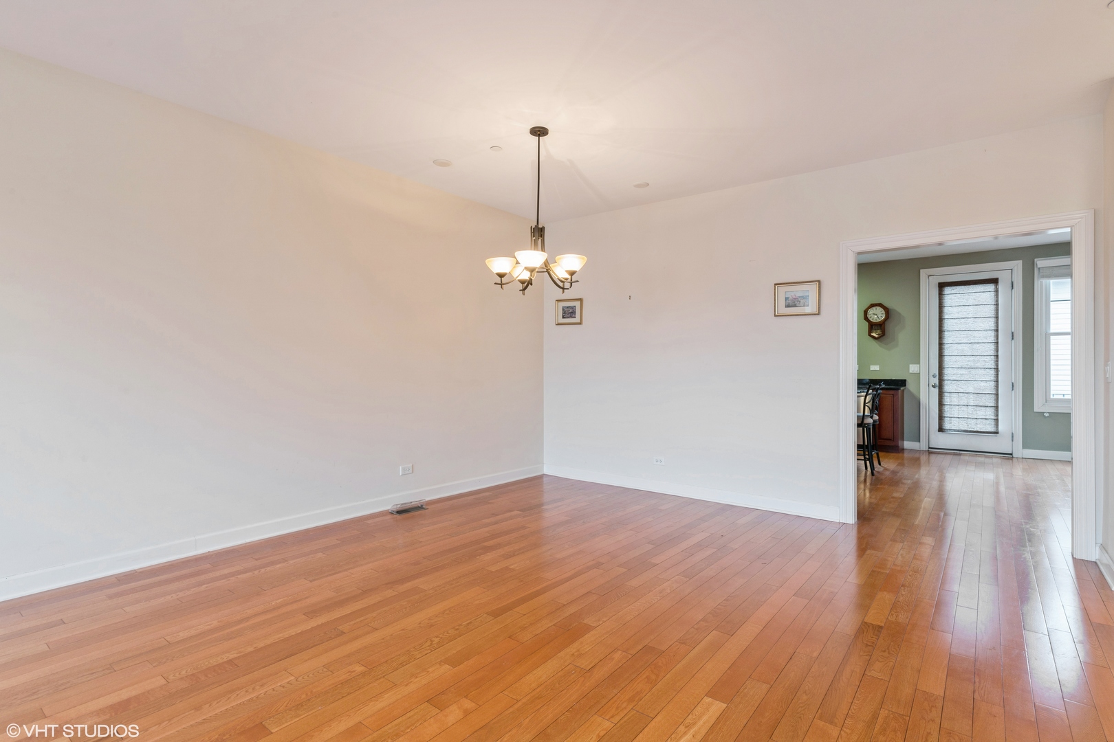 13 Busse Highway Park Ridge, IL 60068 - Photo 6 of 28 a view of a room with wooden floor ceiling fan and window