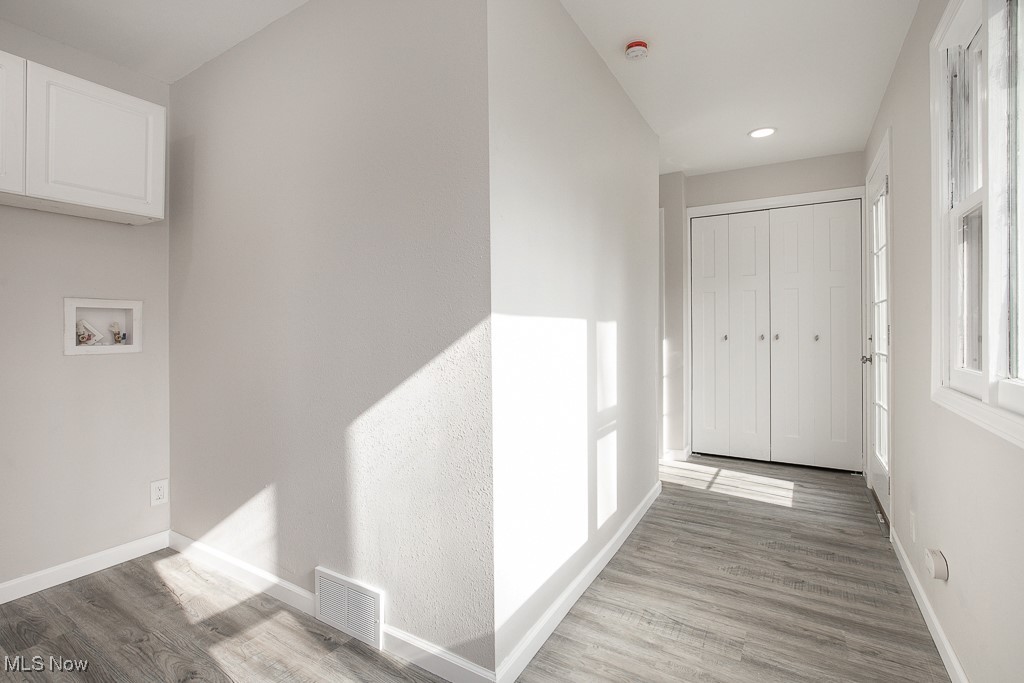 223 Beck Road Avon Lake, OH 44012 - Photo 15 of 29 Laundry featuring recessed lighting, visible vents, wood finished floors, and baseboards