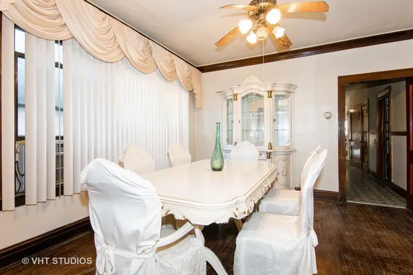 a dining room with furniture and window