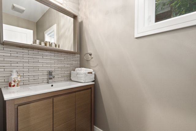 Undisclosed Address Chicago, IL 60634 - Photo 16 of 44 a bathroom with a sink and a mirror