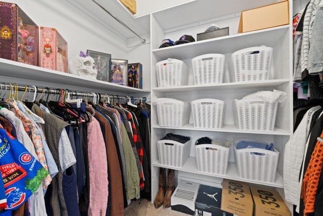 Undisclosed Address Chicago, IL 60634 - Photo 19 of 44 a view of walk in closet with clothes and shoes