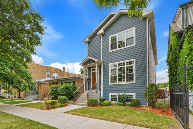 Undisclosed Address Chicago, IL 60634 - Photo 2 of 44 front view of a house with a yard