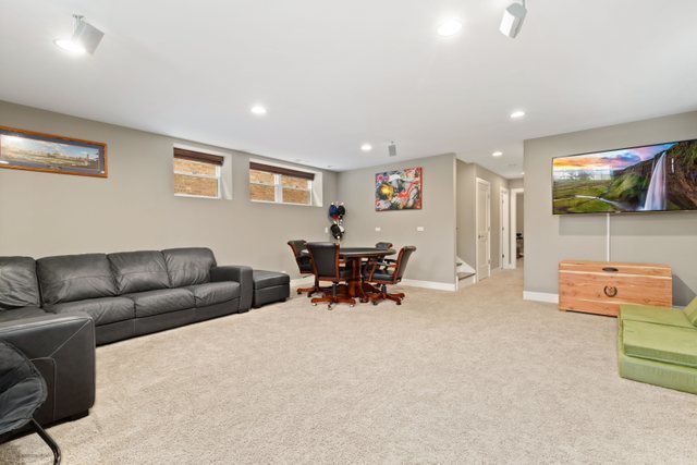 Undisclosed Address Chicago, IL 60634 - Photo 28 of 44 a living room with furniture and a flat screen tv