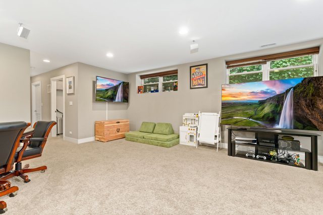 Undisclosed Address Chicago, IL 60634 - Photo 29 of 44 a living room with furniture and a flat screen tv