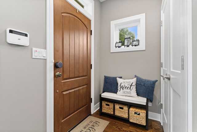 Undisclosed Address Chicago, IL 60634 - Photo 3 of 44 a bedroom with furniture and a painting