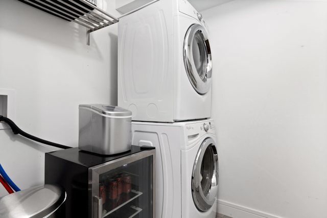 Undisclosed Address Chicago, IL 60634 - Photo 32 of 44 a utility room with dryer and washer