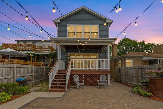 Undisclosed Address Chicago, IL 60634 - Photo 34 of 44 a front view of a house with garage