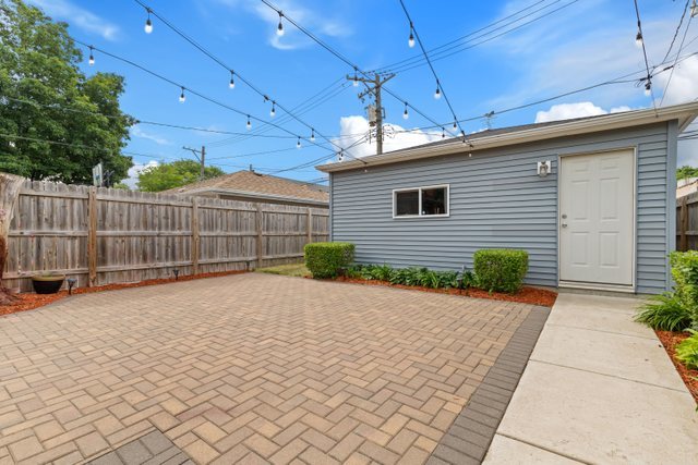 Undisclosed Address Chicago, IL 60634 - Photo 37 of 44 a view of a backyard of a house with wooden fence
