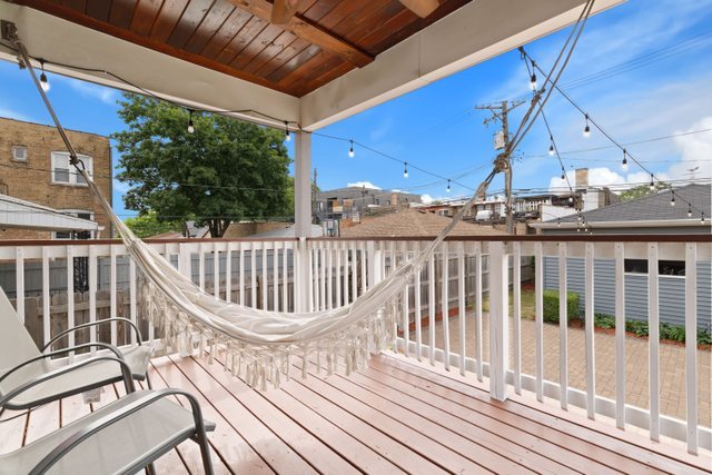 Undisclosed Address Chicago, IL 60634 - Photo 39 of 44 a view of a balcony with wooden floor