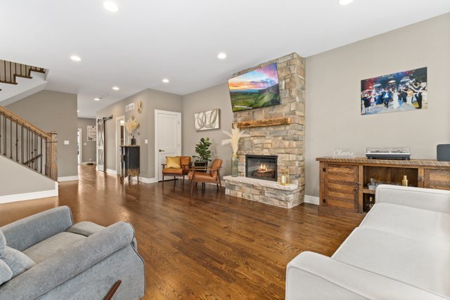Undisclosed Address Chicago, IL 60634 - Photo 5 of 44 a living room with furniture and a fireplace