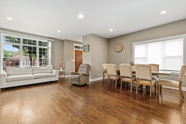 Undisclosed Address Chicago, IL 60634 - Photo 7 of 44 a living room with lots of furniture and a large window