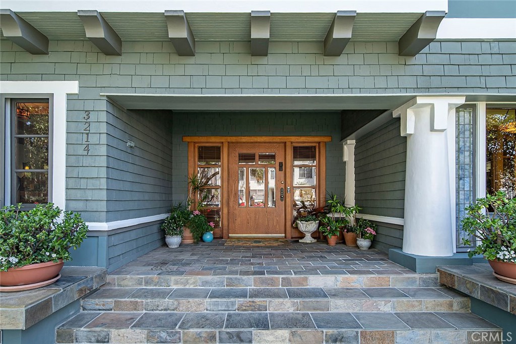 3216 2nd Street Long Beach, CA 90803 - Photo 1 of 62 a view of house with chair and potted plants