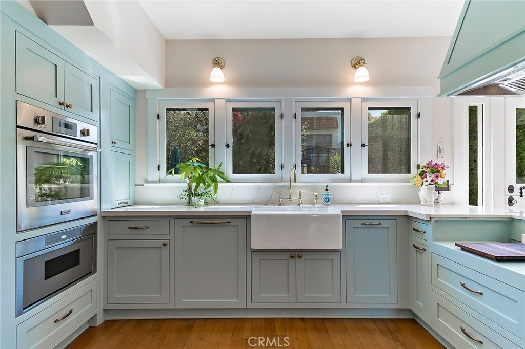 3216 2nd Street Long Beach, CA 90803 - Photo 21 of 62 a kitchen with stainless steel appliances granite countertop a sink and cabinets