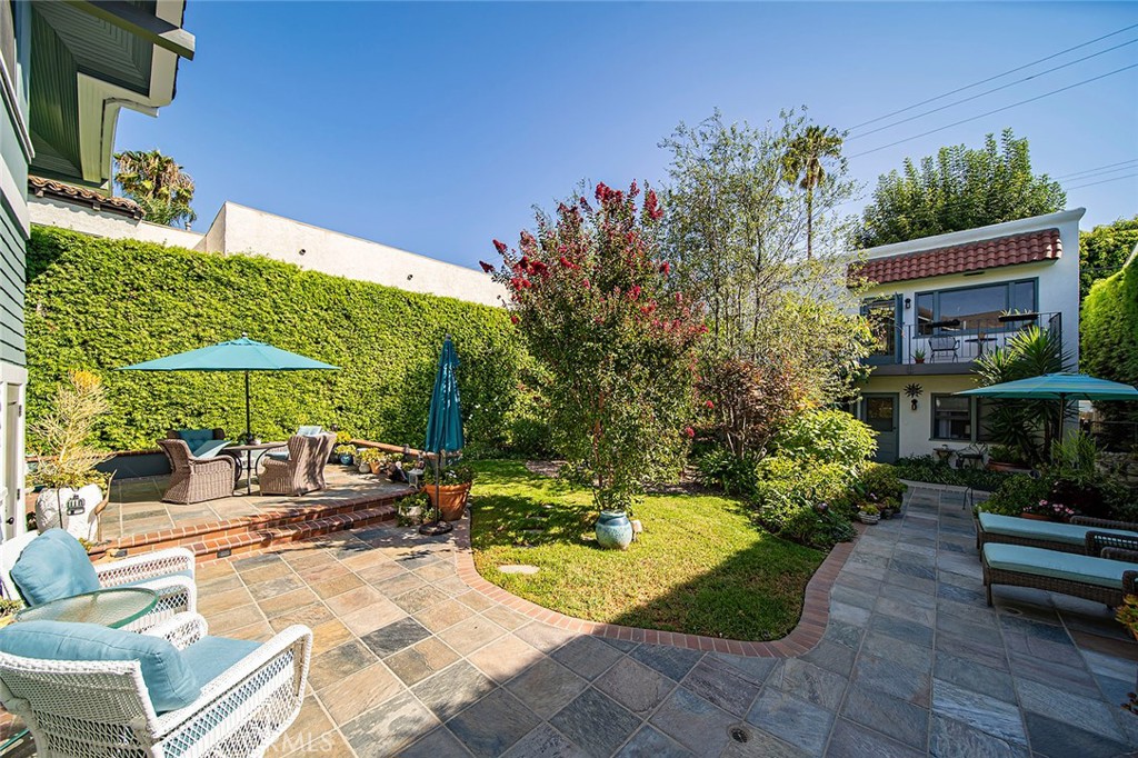 3216 2nd Street Long Beach, CA 90803 - Photo 3 of 62 a view of a backyard with plants and a patio