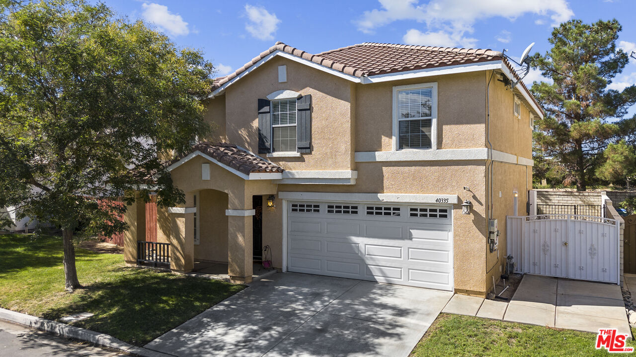 40335 Reata Road Palmdale, CA 93550 - Photo 1 of 37 a front view of a house with a yard