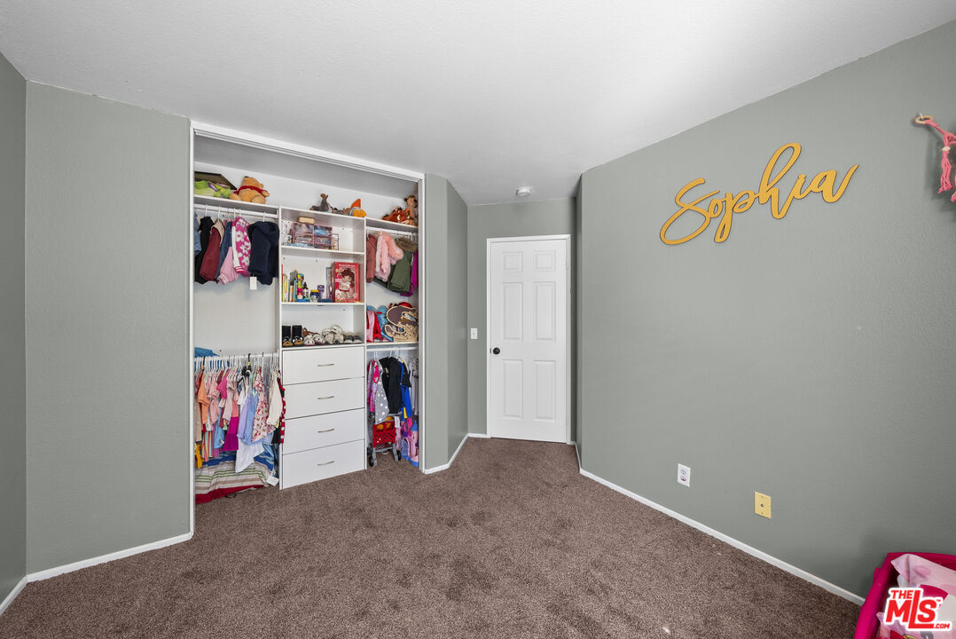 40335 Reata Road Palmdale, CA 93550 - Photo 17 of 37 a view of storage and utility room with toys