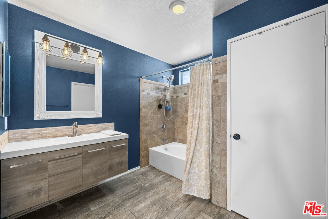 40335 Reata Road Palmdale, CA 93550 - Photo 26 of 37 a bathroom with a double vanity sink mirror and toilet