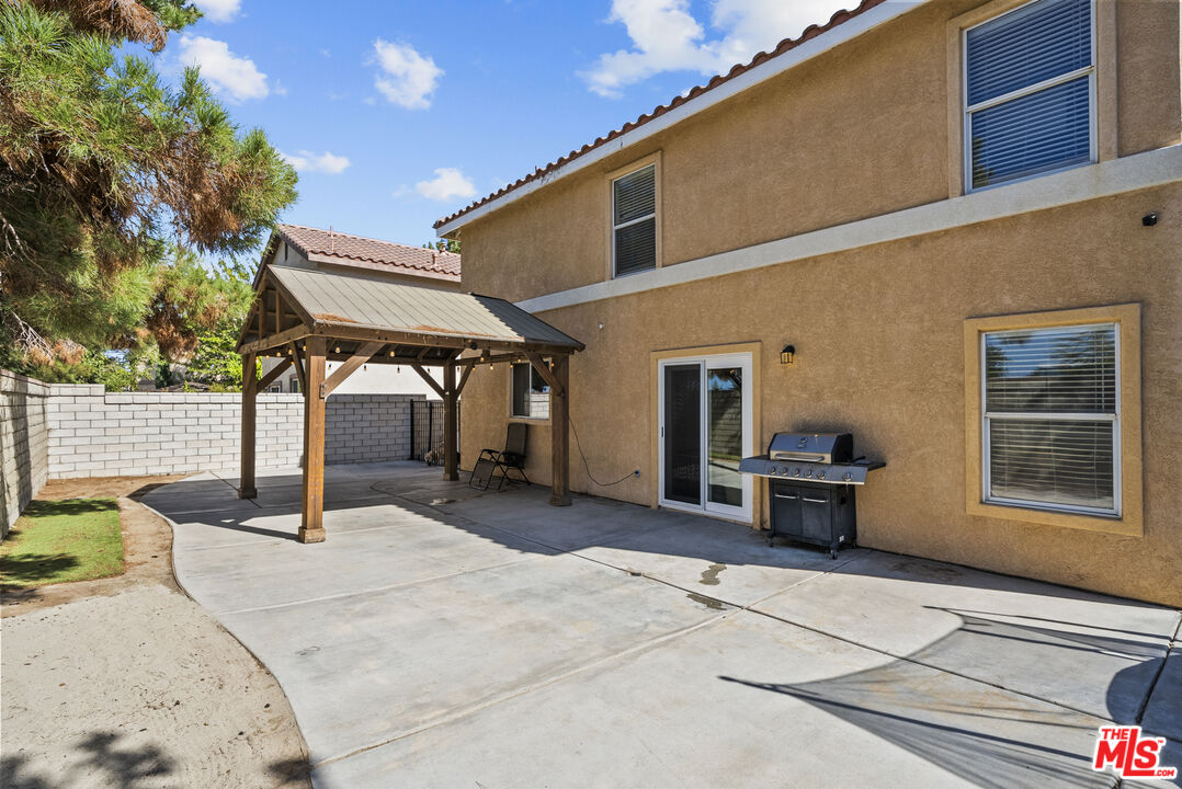 40335 Reata Road Palmdale, CA 93550 - Photo 31 of 37 a building exterior with furniture