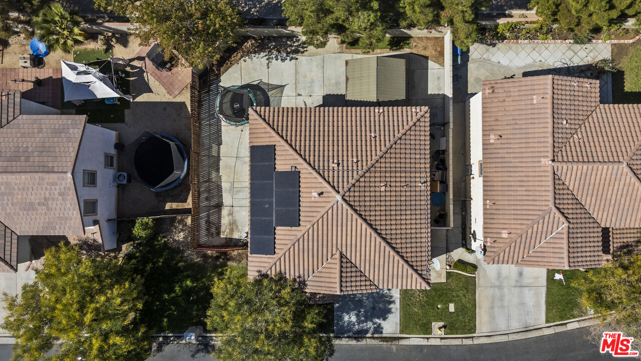 40335 Reata Road Palmdale, CA 93550 - Photo 37 of 37 an aerial view of a house with a yard and potted plants