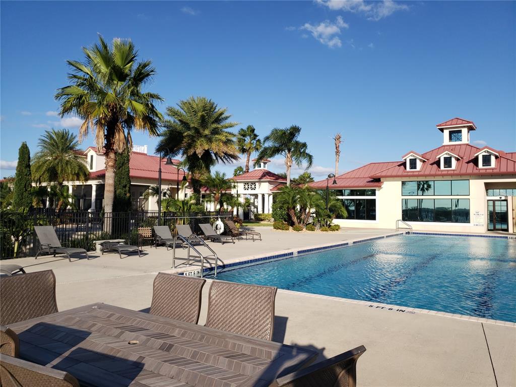 412 Adams View Lane Auburndale, FL 33823 - Photo 12 of 21 a swimming pool with outdoor seating and yard