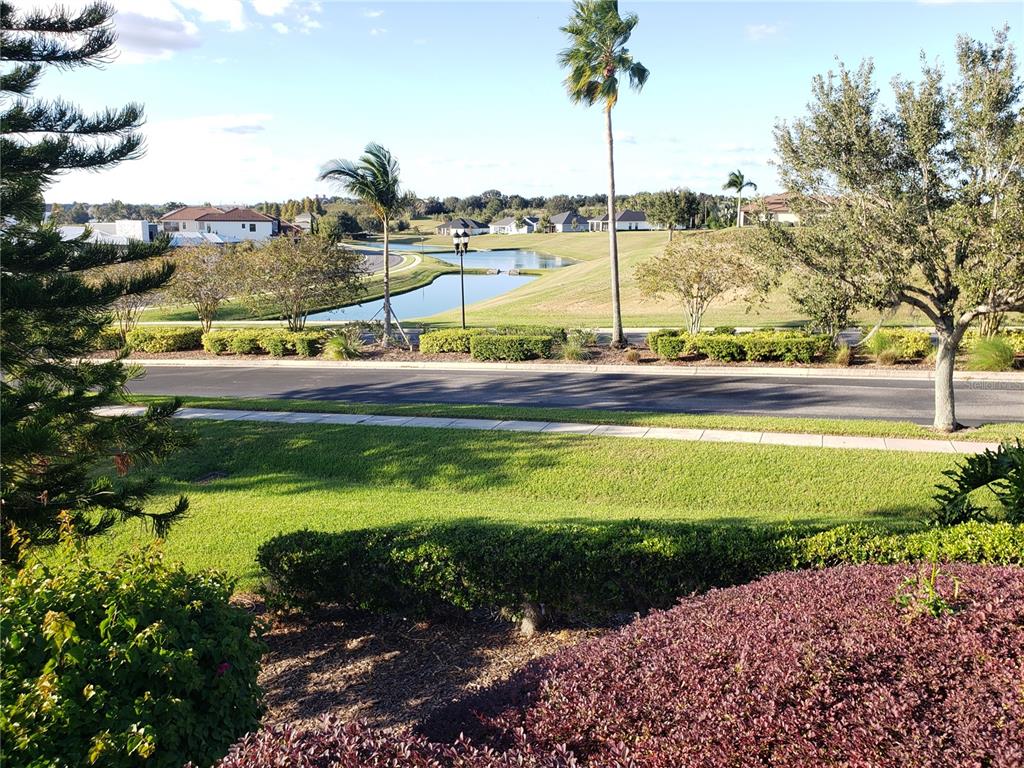 412 Adams View Lane Auburndale, FL 33823 - Photo 17 of 21 a view of a swimming pool with a lawn chairs under an umbrella