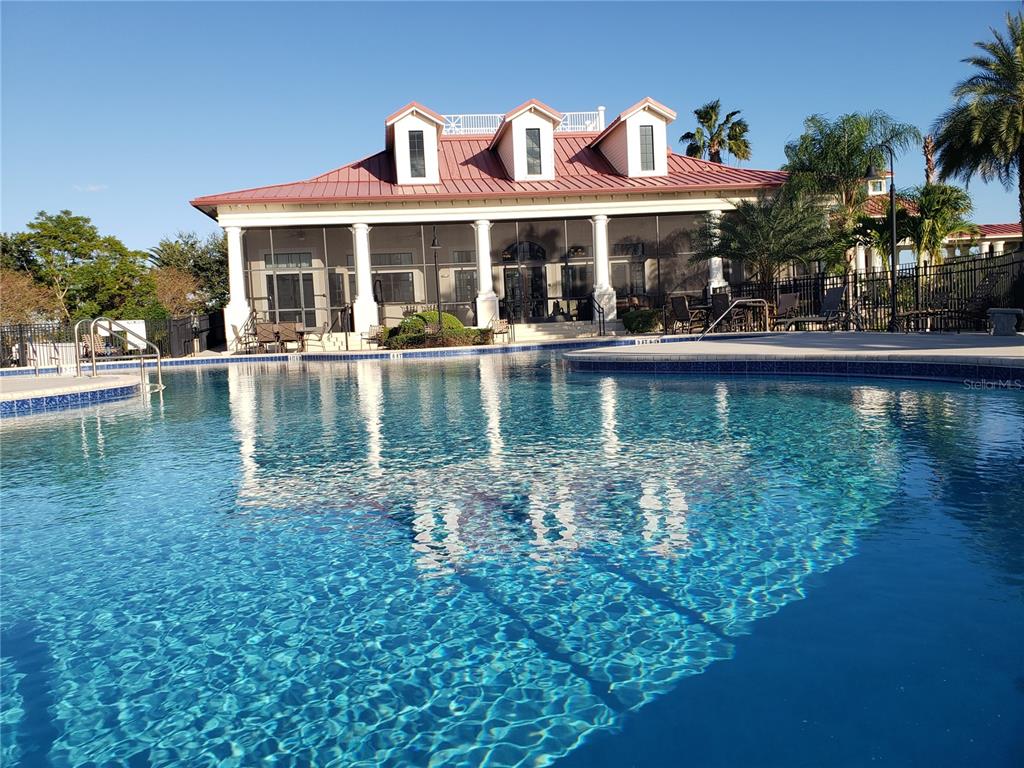 412 Adams View Lane Auburndale, FL 33823 - Photo 18 of 21 a view of a house with swimming pool and a chairs