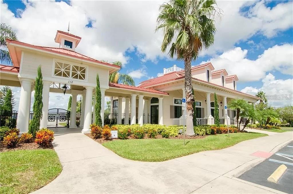 412 Adams View Lane Auburndale, FL 33823 - Photo 6 of 21 a front view of a building with garden and trees