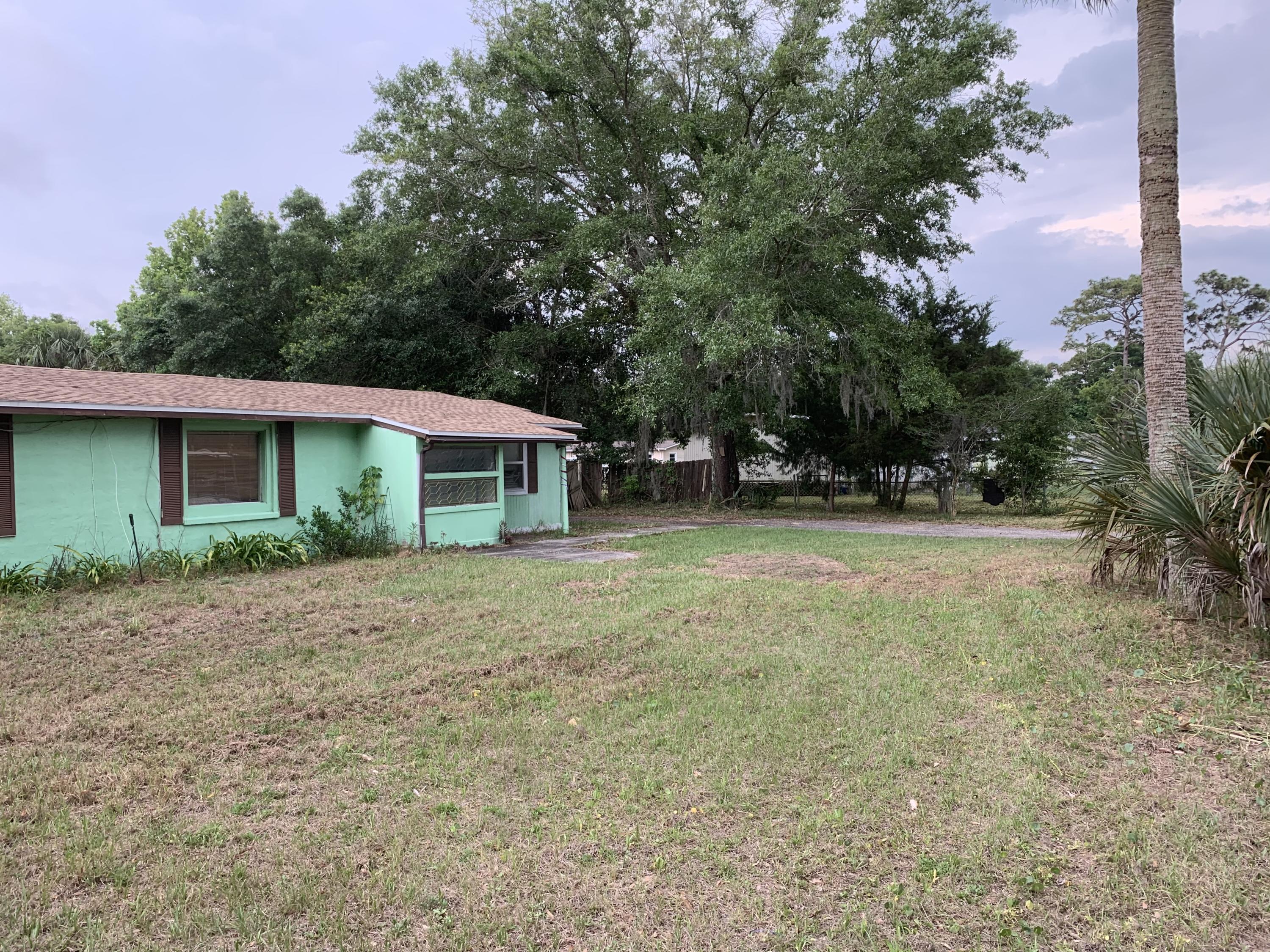 211 Jackson Road Jacksonville, FL 32225 - Photo 3 of 16 a front view of a house with garden
