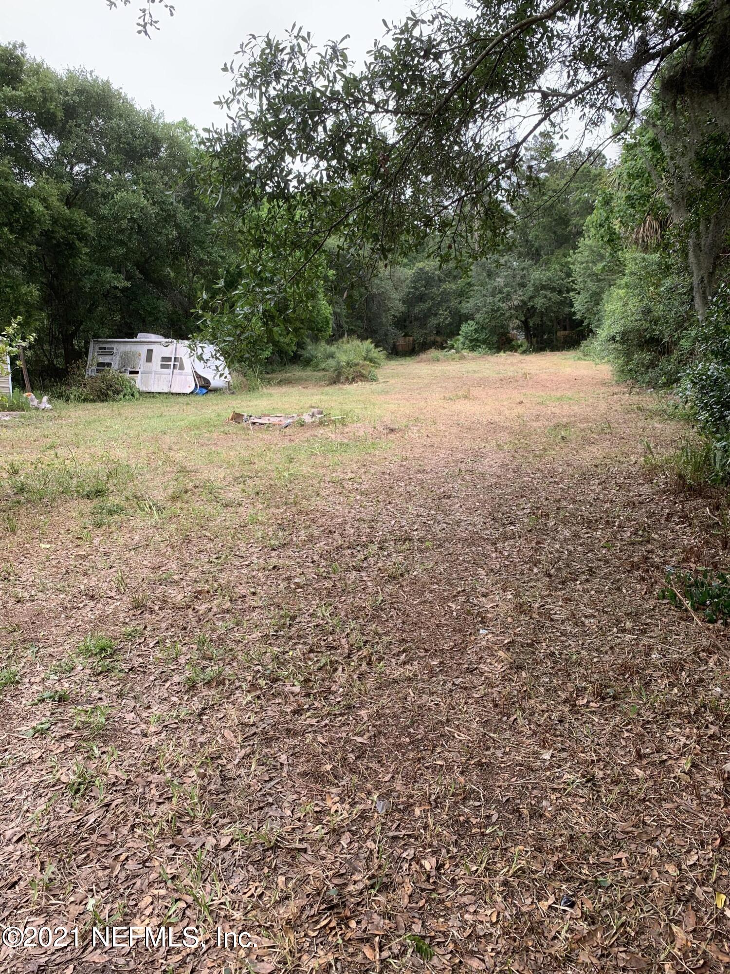 211 Jackson Road Jacksonville, FL 32225 - Photo 8 of 16 a view of a yard with a tree