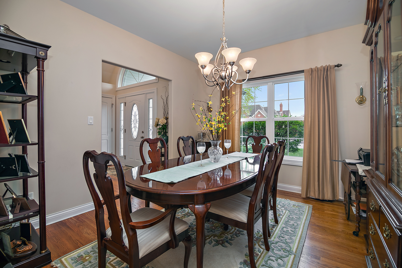 318 Maple Street Beecher, IL 60401 - Photo 11 of 27 a view of a dining room with furniture wooden floor and a chandelier